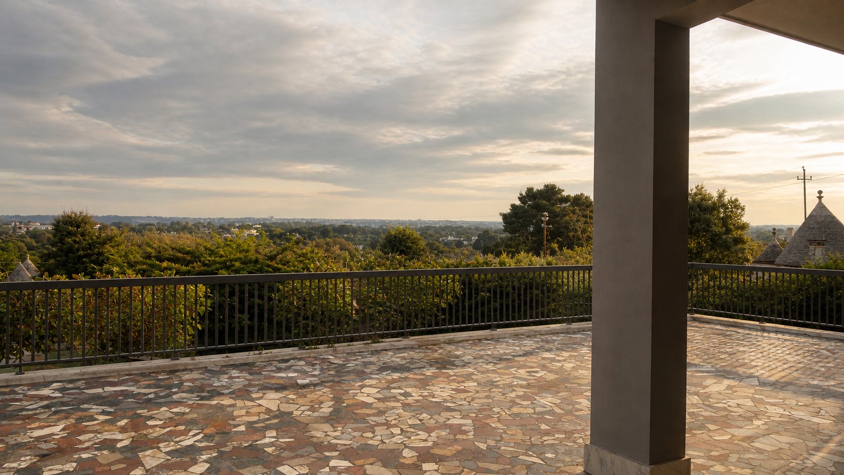 Panoramic terrace with mosaic stone paving and view over the Itria Valley